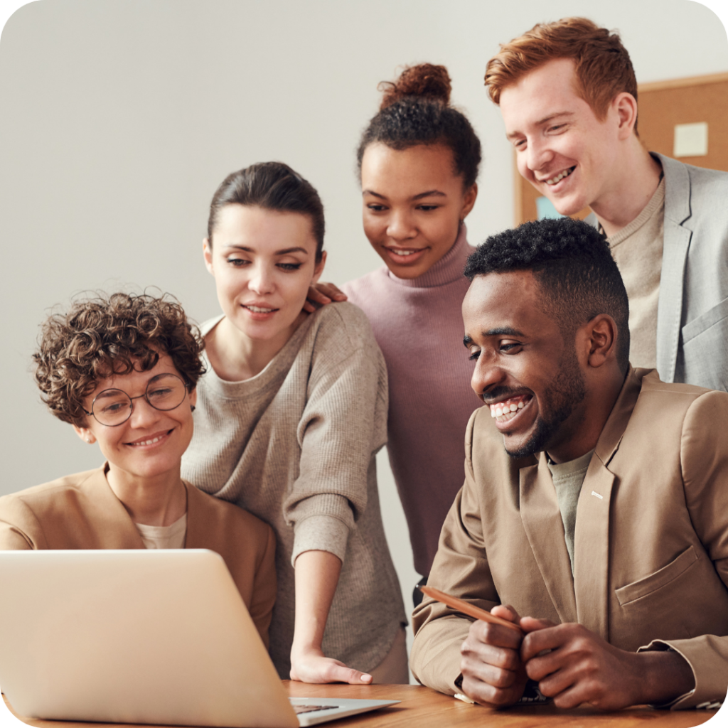 group of people looking at laptop, learning about climate change